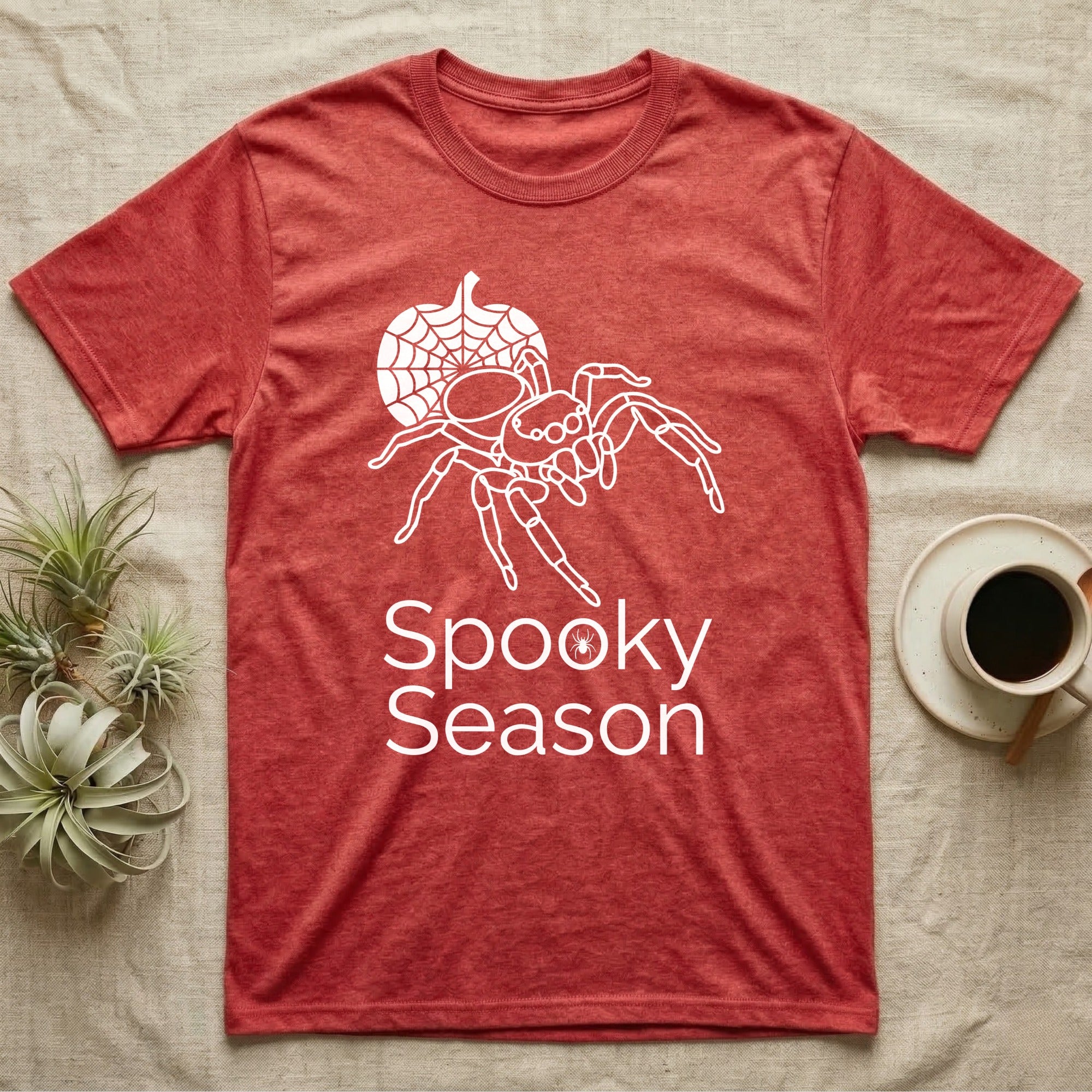 Jumping Spider Spooky Season T-Shirt in Heather Red — Minimal continuous-line jumping spider over a spiderweb pumpkin, text "Spooky Season" with a spider in the O.
