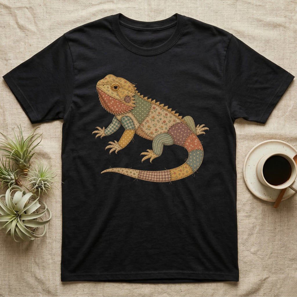 Black t-shirt featuring a patchwork lizard graphic.