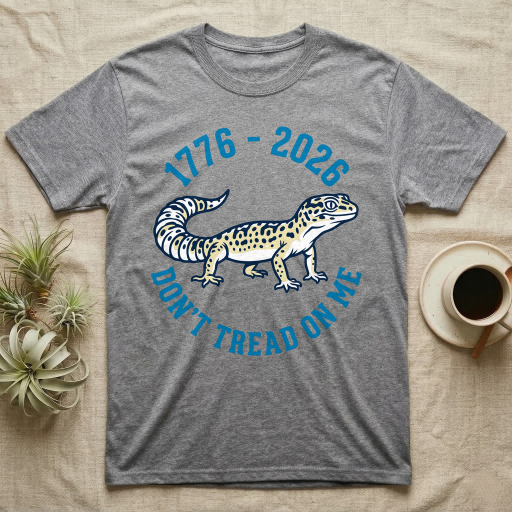 Leopard Gecko 1776 T-Shirt in Sport Grey — Two-colour vector leopard gecko in profile ringed by arched text reading 1776 to 2026 and Don't Tread On Me.