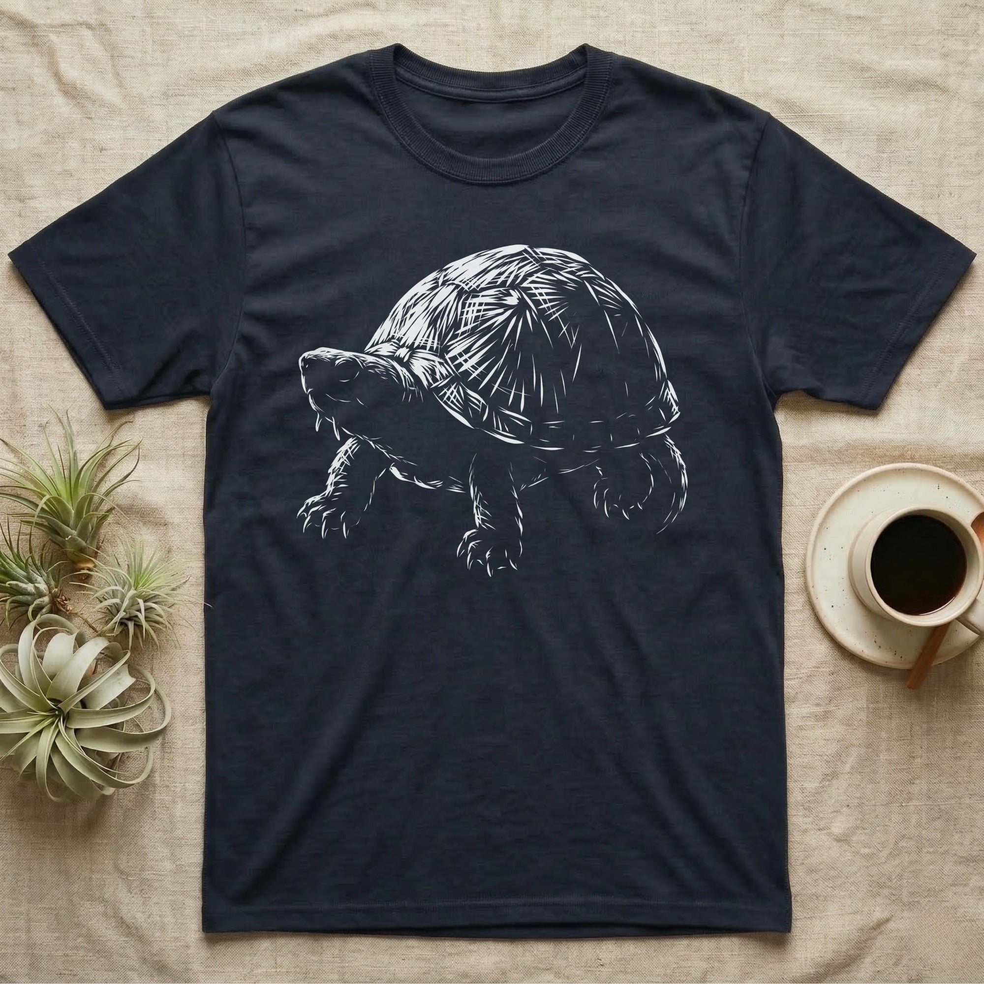 Musk Turtle Stinkpot T-Shirt in Navy — Rim-lit negative-space illustration of a small musk turtle in badge-scale portrait against a dark ground.