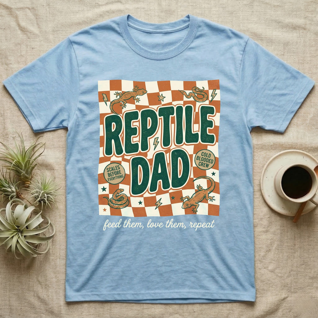 Light blue t-shirt with "Reptile Dad" text, scales, and snakes.