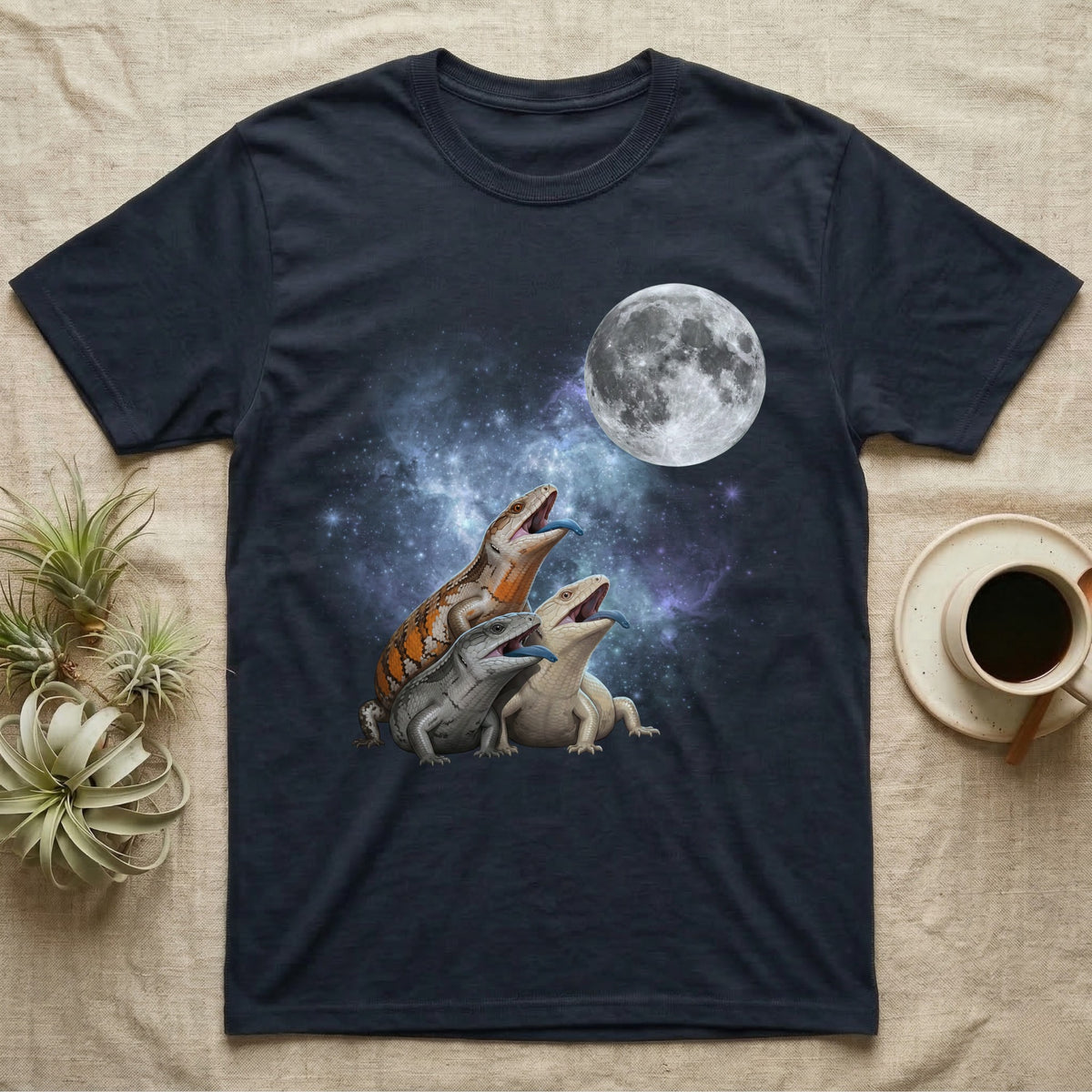 Blue-Tongued Skink Moon Howl T-Shirt in Navy — Three Blue-Tongued Skink colour morphs howling at a full moon over a nebula on a dark grey t-shirt.