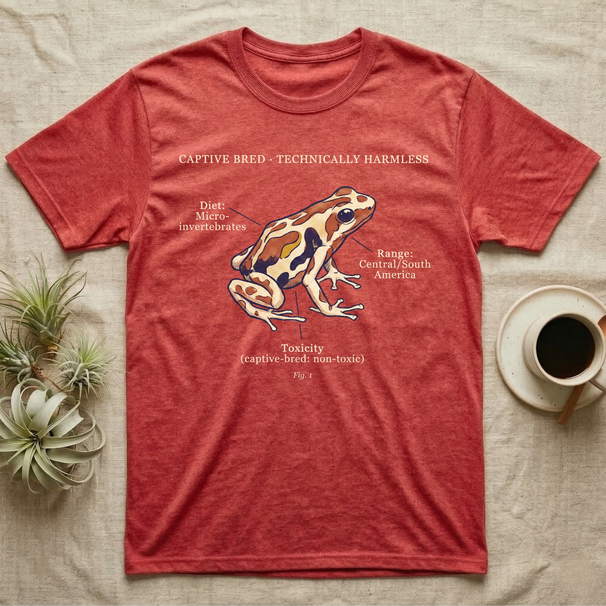Captive Bred Dart Frog T-Shirt in Heather Red — Retro science-plate illustration of a labeled dart frog with field-guide callouts and a captive-bred non-toxic note.