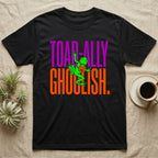 Tree Frog Toad-ally Ghoulish T-Shirt in Black — Neon green tree frog with a pumpkin pail clinging across stacked text, "Toad-ally Ghoulish."