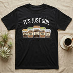 Isopod Soil Bins T-Shirt in Black — Watercolour row of five labelled bins of soil with isopods on the lids under the words IT'S JUST SOIL