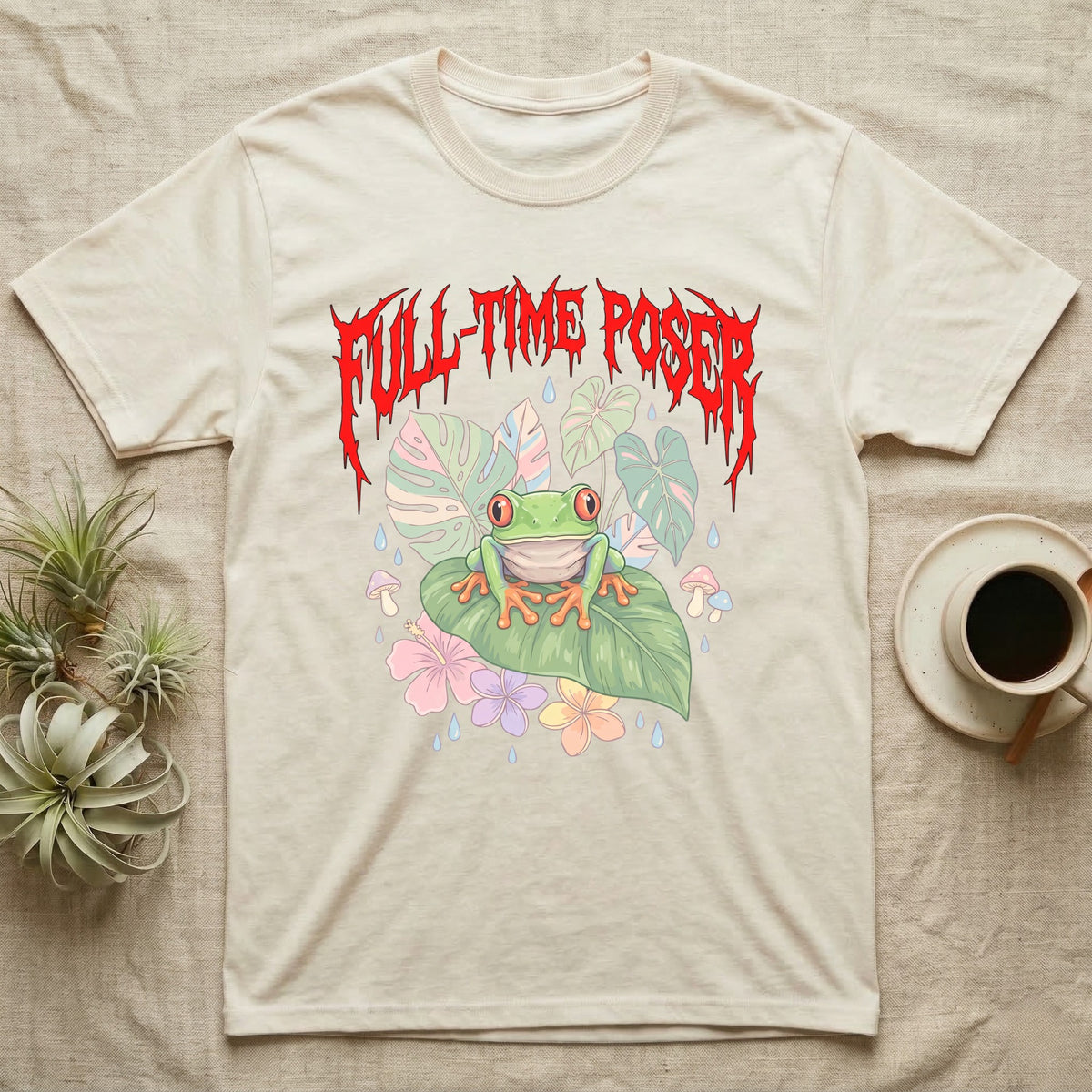 Red-Eyed Tree Frog Feral T-Shirt in Natural — Red-eyed tree frog on a leaf in a pastel jungle scene under a spiky red metal wordmark reading FULL-TIME POSER.