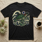 Black t-shirt with a green sea turtle in stylized waves under a red sun.