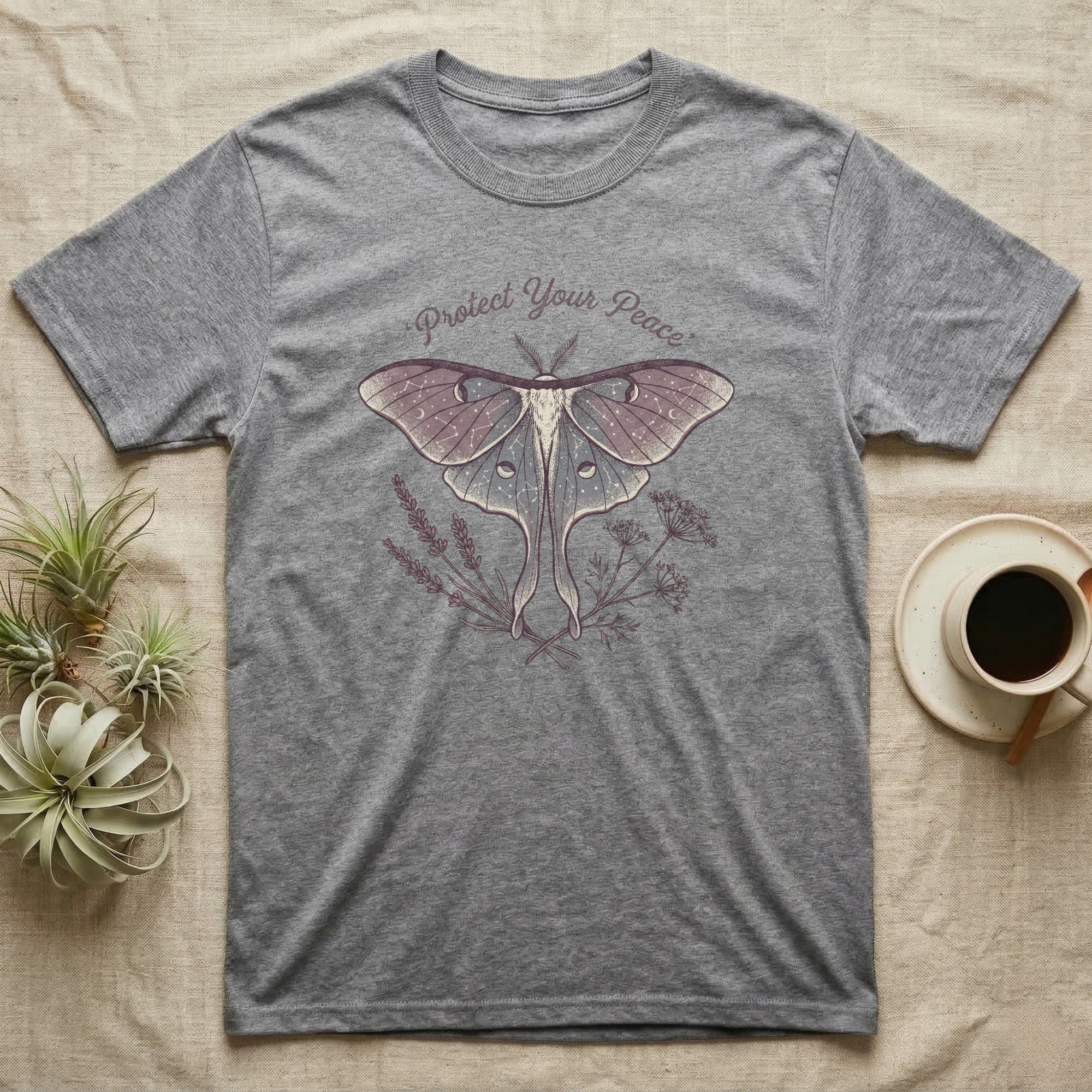 Grey t-shirt with a moth and "Protect Your Peace" text.