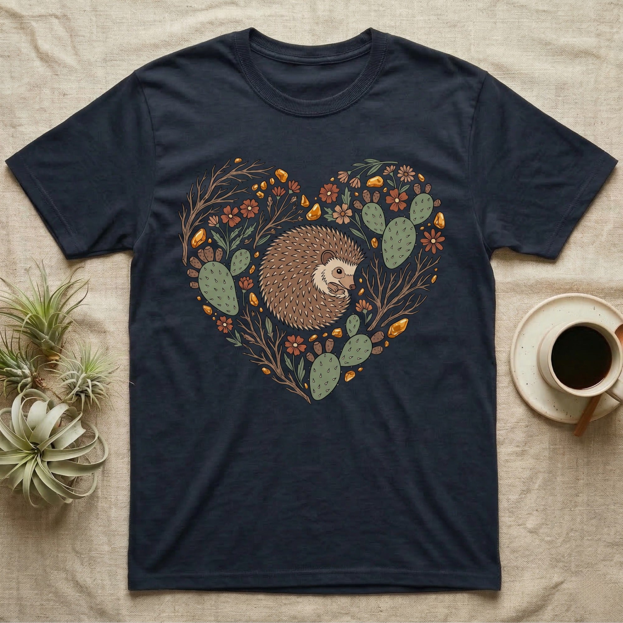 Dark t-shirt with hedgehog and cactus heart design.