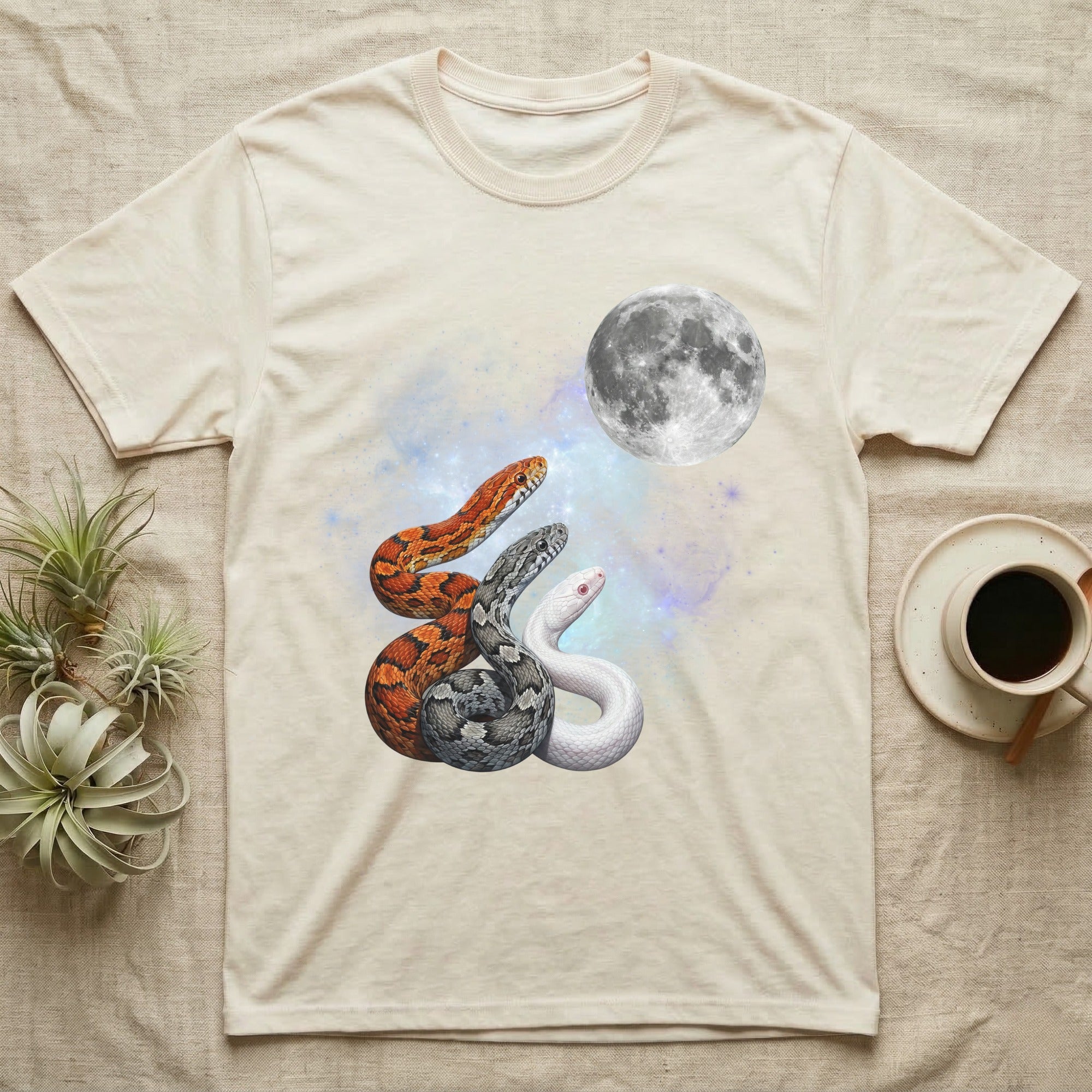 Corn Snake Moon Howl T-Shirt in Natural — Three Corn Snake colour morphs howling at a full moon over a nebula on a dark grey t-shirt.