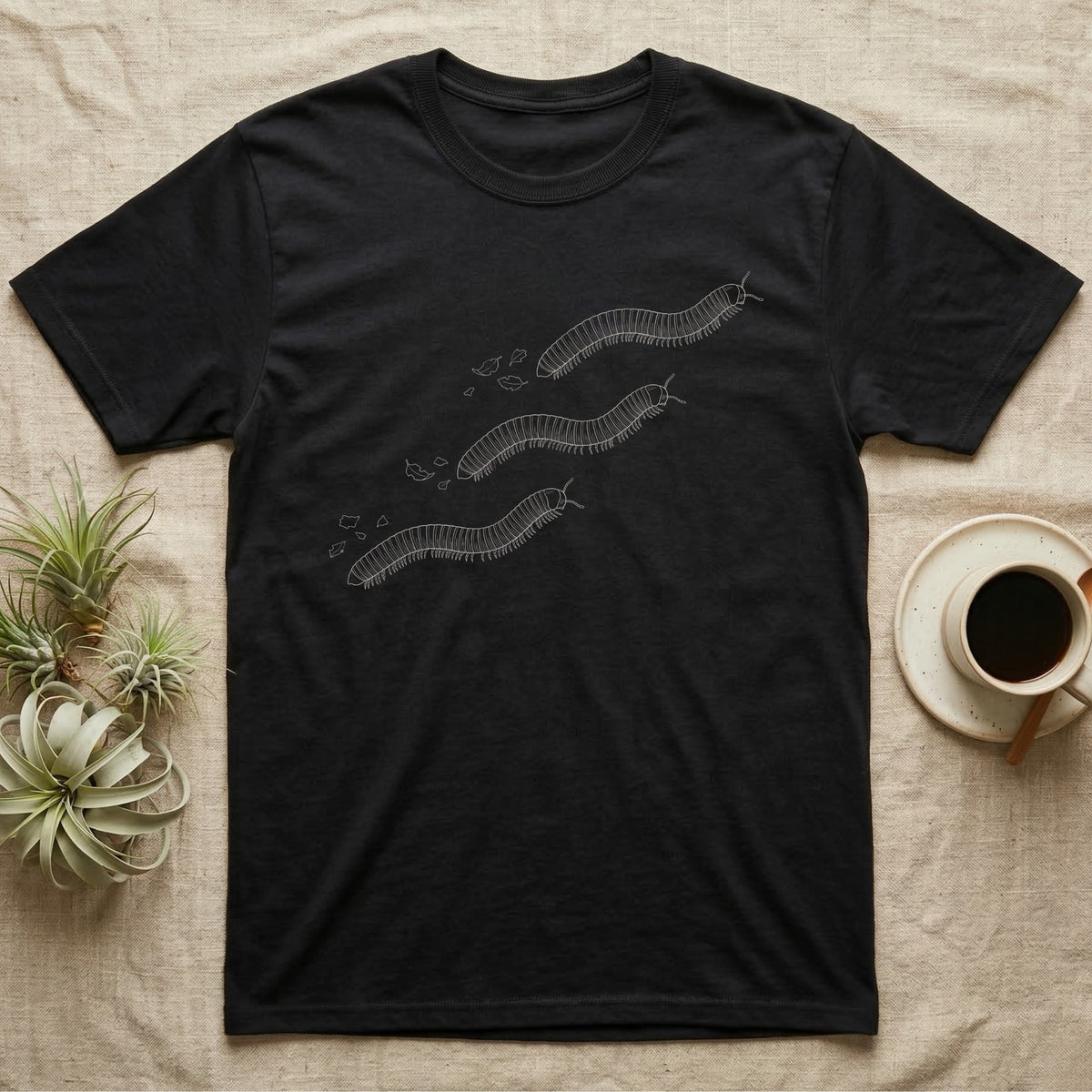 Giant African Millipede Procession T-Shirt in Black — Pen-and-ink line illustration of three giant African millipedes travelling in step on a rising diagonal.