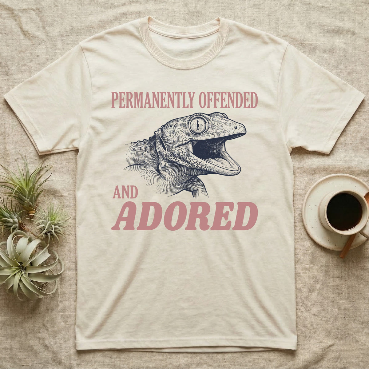 Tokay Gecko Permanently Offended T-Shirt in Natural — Engraved tokay gecko head with mouth open, Permanently Offended above and Adored in large type below.
