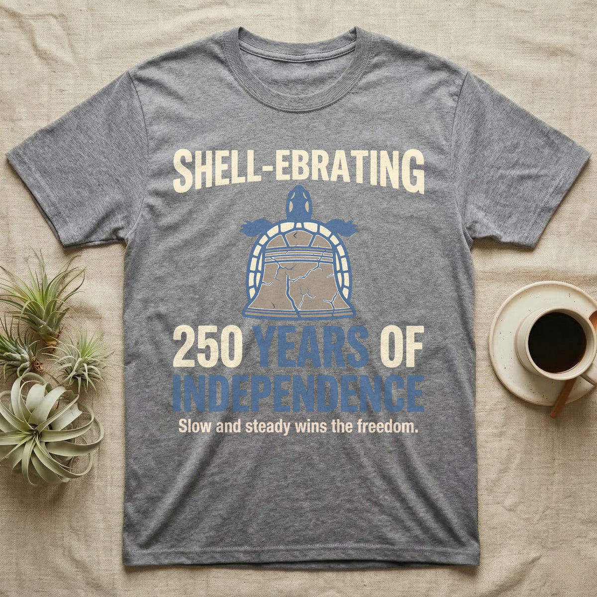 Sea Turtle Liberty Bell T-Shirt in Sport Grey — Slate-blue and cream tee of a sea turtle whose shell is drawn as the Liberty Bell under Shell-Ebrating 250 Years text.