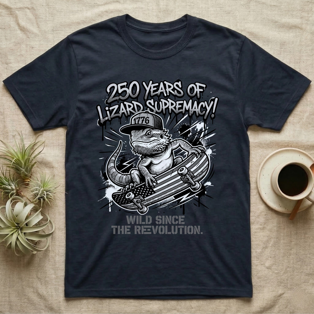 Bearded Dragon Skater T-Shirt in Navy — Black-and-white bearded dragon in a 1776 snapback on a flag skateboard under text 250 Years of Lizard Supremacy.