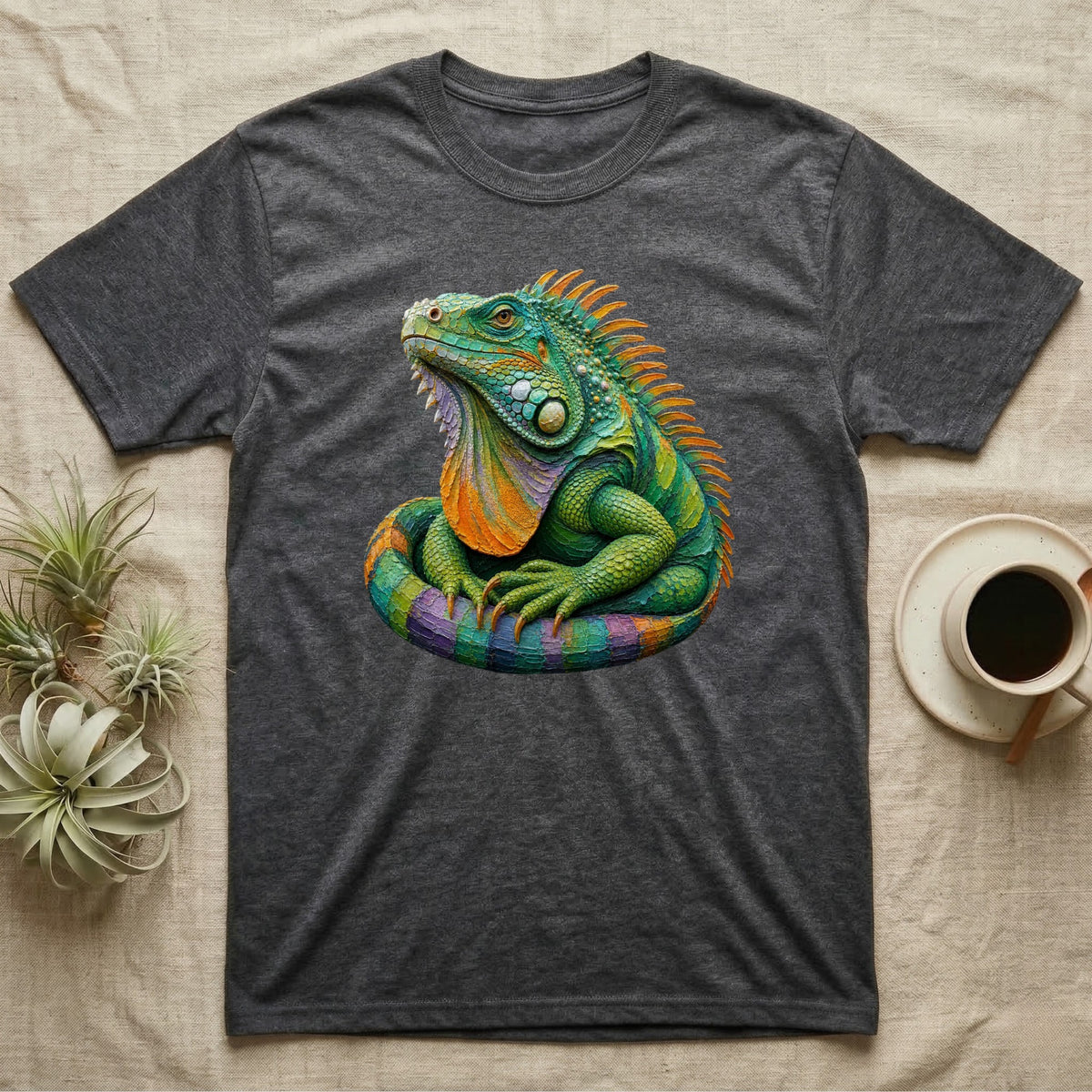 Charcoal t-shirt with a colorful, detailed iguana graphic and coffee cup.