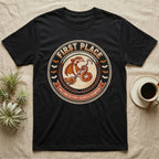Corn Snake Poop Scooper Champion T-Shirt in Black — Vintage award badge with a caped corn snake holding a scoop hook, "First Place Halloween Poop Scooper Champion."