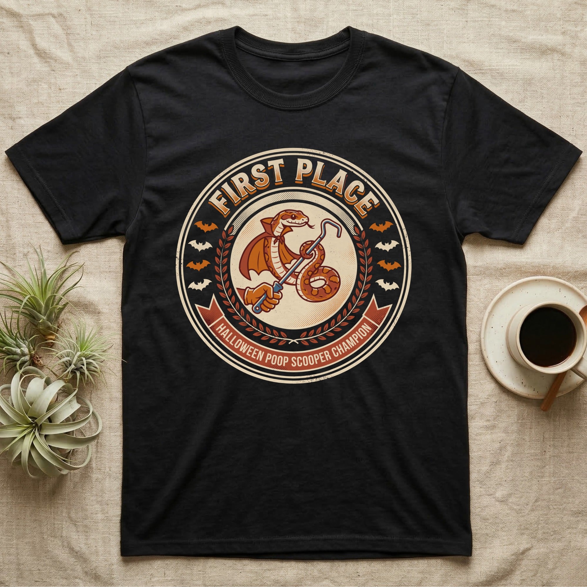 Corn Snake Poop Scooper Champion T-Shirt in Black — Vintage award badge with a caped corn snake holding a scoop hook, "First Place Halloween Poop Scooper Champion."