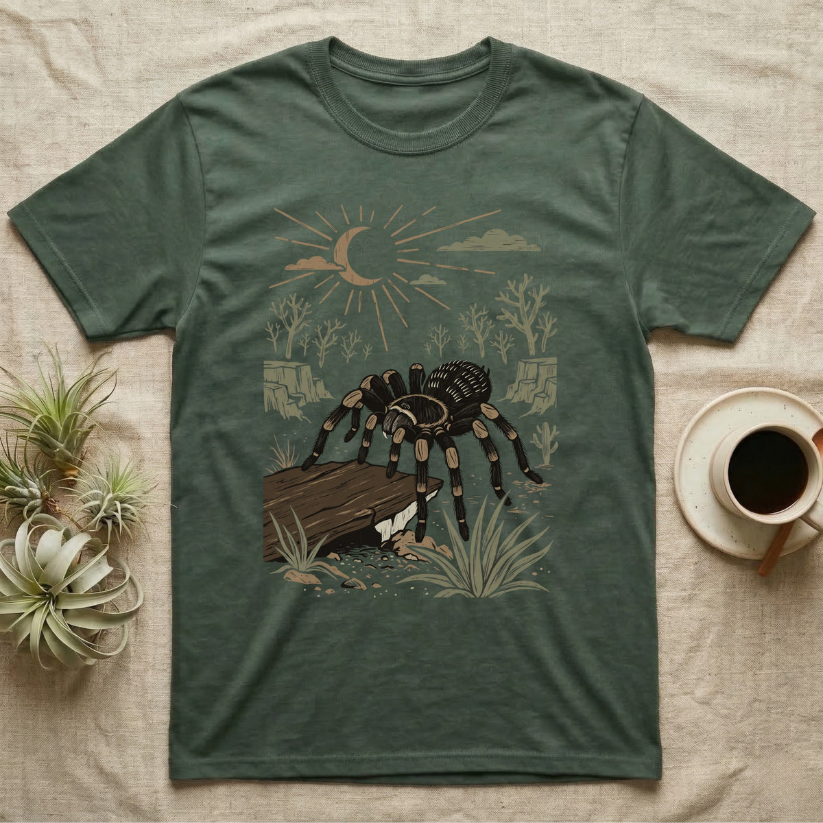 Red-Knee Tarantula Home Range T-Shirt in Military Green — Woodcut-style illustration of a Mexican red-knee tarantula at its burrow entrance under a rock slab with desert scrub behind, no on-shirt text.