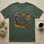 Green t-shirt with a spider and floral design in an ornate circular frame.