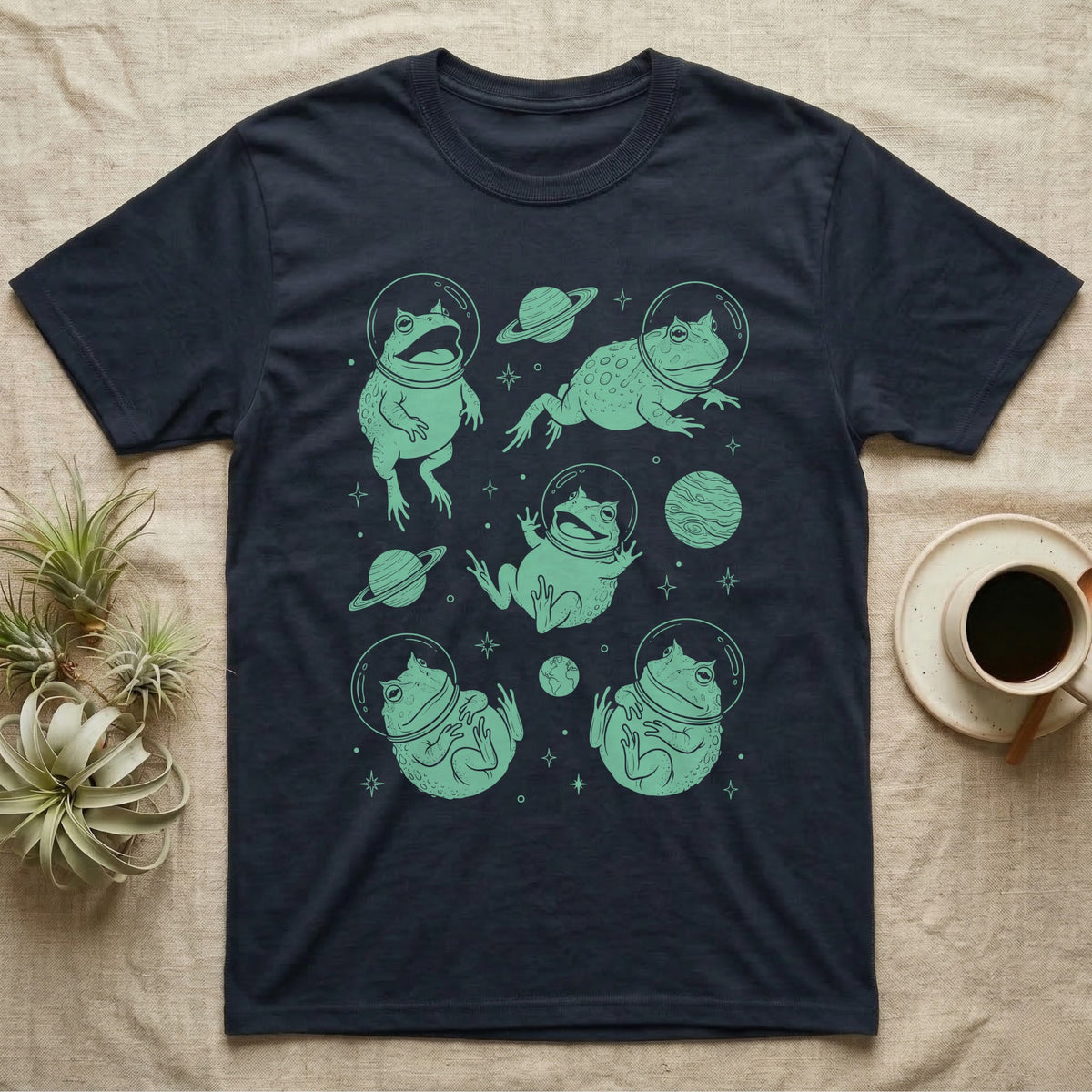 Pacman Frog Cosmic T-Shirt in Navy — Vintage screen-print illustration of Pacman frogs in astronaut helmets floating in space, cosmic jade green monochromatic on dark background.