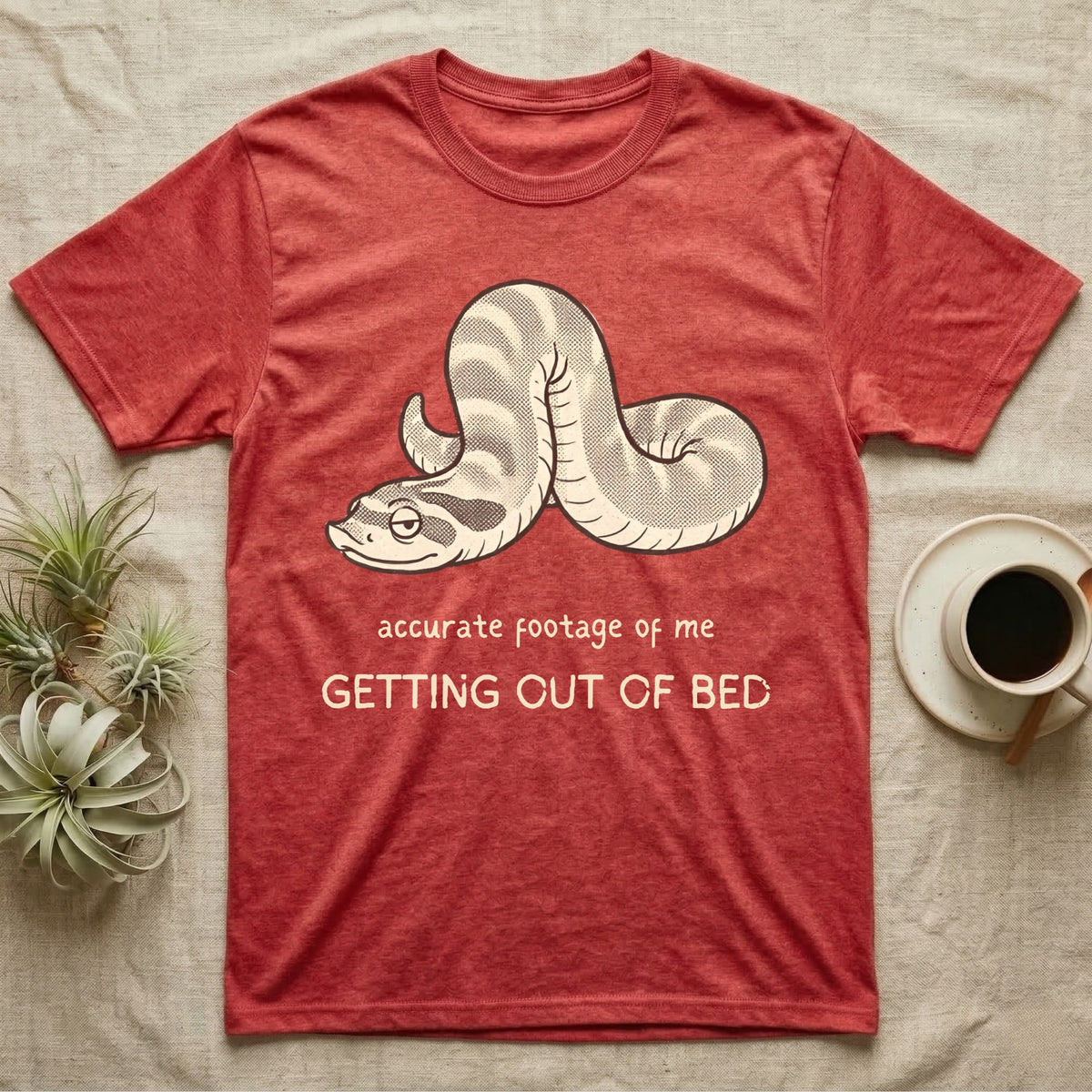 Hognose Morning Mood T-Shirt in Heather Red — Retro-illustration of a hognose snake flopped limp with hand-drawn marker text about getting out of bed.