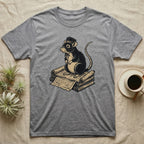 Grey t-shirt with a graphic of a rat wearing a hat on a stack of scrolls.