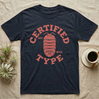 Isopod Certified Morph T-Shirt in Navy — Carved block-print isopod seen from above inside a ring of terracotta lettering reading CERTIFIED NOT WILD TYPE.