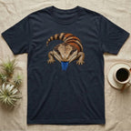 Blue-tongued skink with bright blue tongue sticking out on a dark t-shirt.