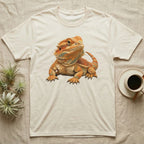 Beige t-shirt with illustration of a detailed orange bearded dragon.