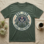 Tarantula Zero Coffins T-Shirt in Military Green — Circular patch emblem of a tarantula in a top hat with arched text Est. 1776 and 8 Legs Zero Coffins.