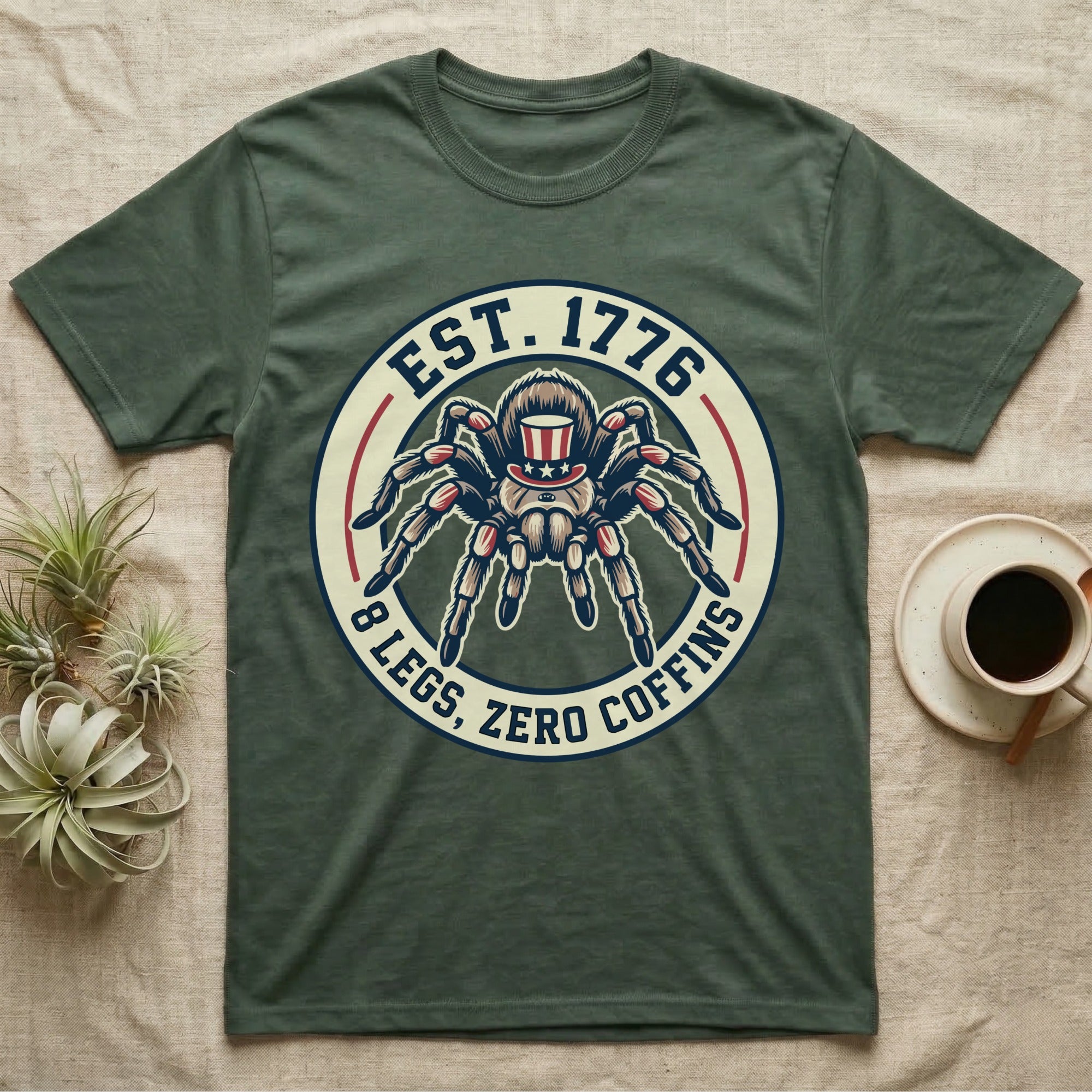 Tarantula Zero Coffins T-Shirt in Military Green — Circular patch emblem of a tarantula in a top hat with arched text Est. 1776 and 8 Legs Zero Coffins.