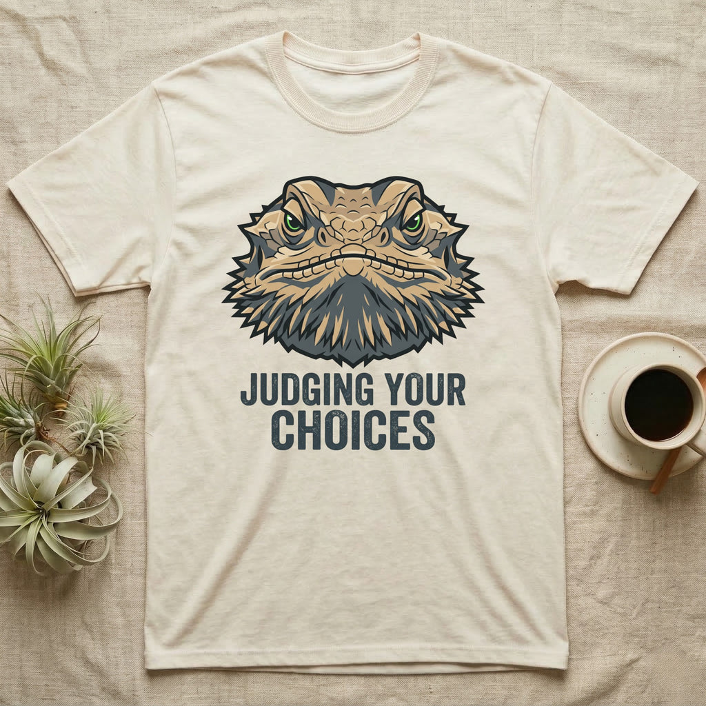 Cream t-shirt with bearded dragon graphic and "JUDGING YOUR CHOICES" text.