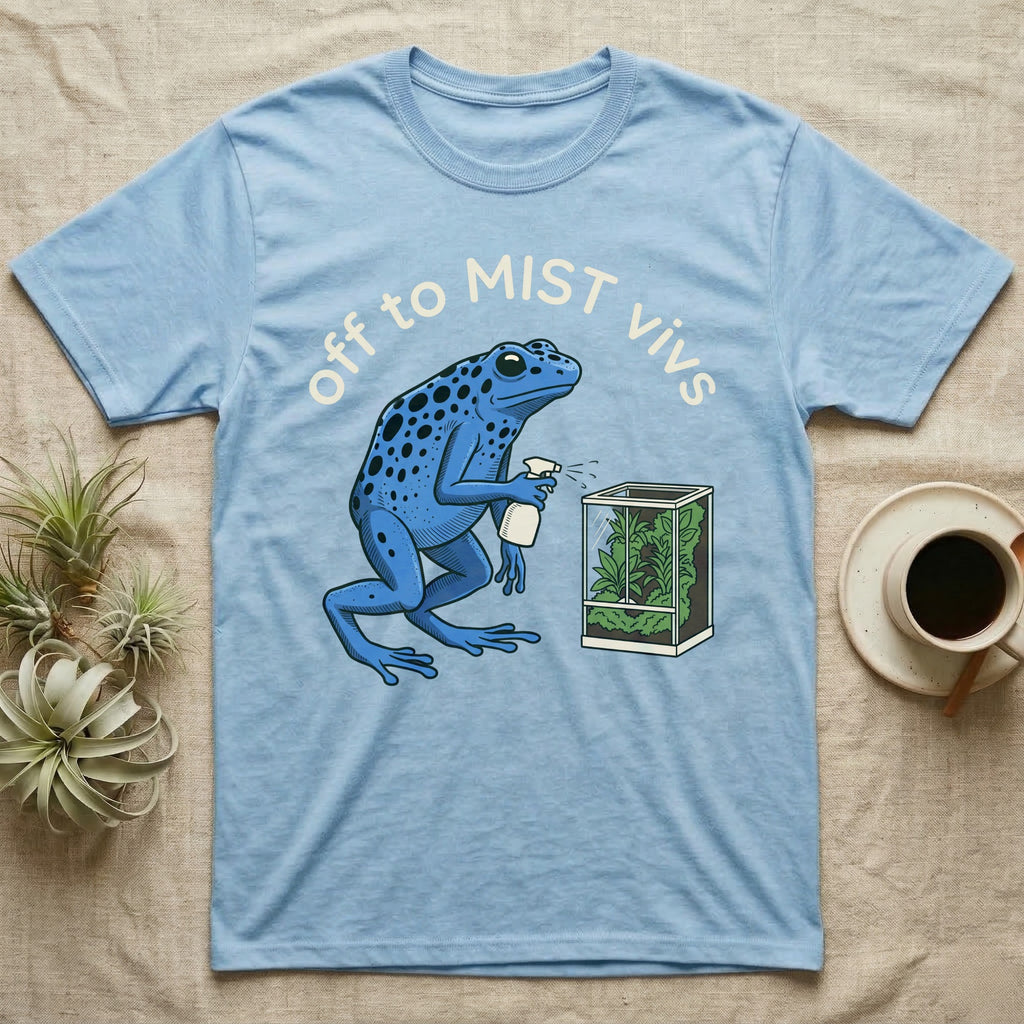 Dart Frog Misting T-Shirt in Light Blue — Spotted blue dart frog spraying a planted vivarium under the words off to MIST vivs