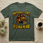 Red-Footed Tortoise Unstoppable Force T-Shirt in Military Green — Metal-style furious tortoise charging a candy pumpkin, "Unstoppable Force At 0.2 Miles Per Hour."