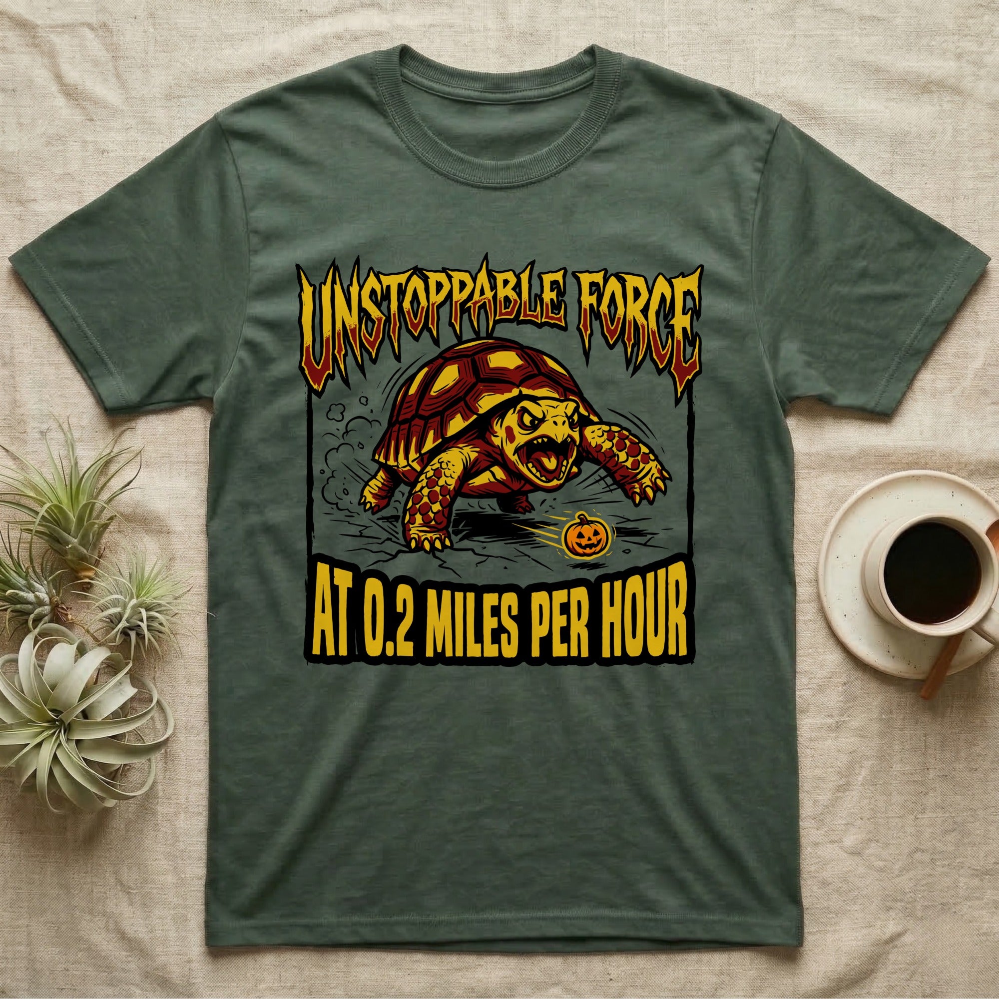 Red-Footed Tortoise Unstoppable Force T-Shirt in Military Green — Metal-style furious tortoise charging a candy pumpkin, "Unstoppable Force At 0.2 Miles Per Hour."