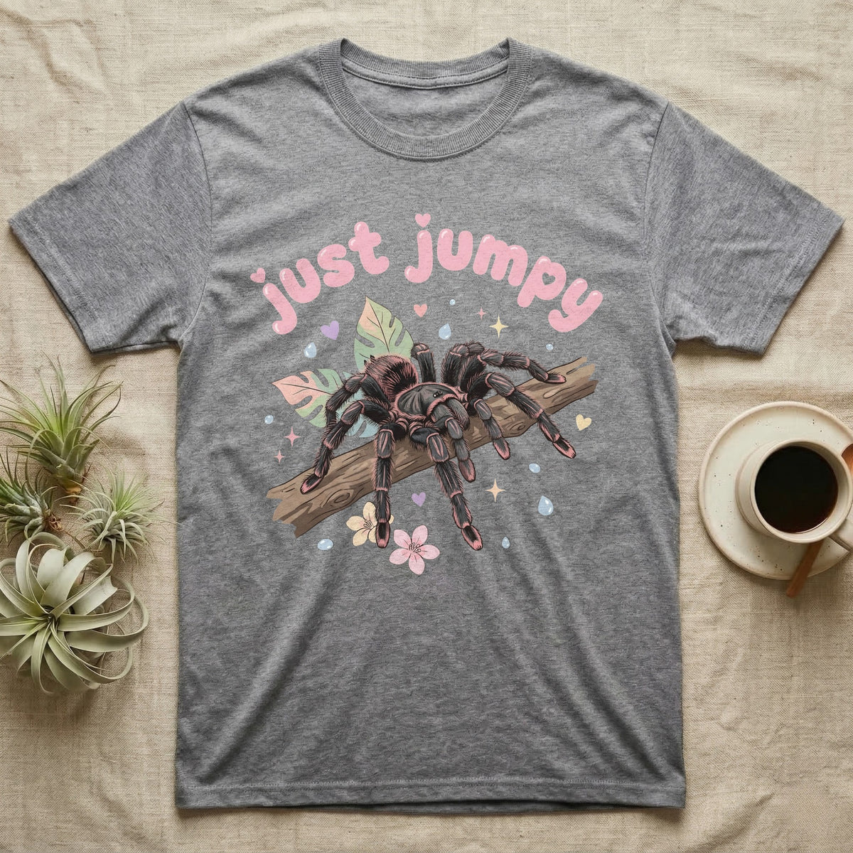 Pink Toe Tarantula Softie T-Shirt in Sport Grey — Pink toe tarantula poised to leap on a branch under a puffy pastel "just jumpy" bubble wordmark with tiny hearts.