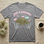 Spiny Softshell Turtle Baby T-Shirt in Sport Grey — Pastel spiny softshell turtle with flat shell and snorkel nose among lily pads, puffy pink wordmark "just a pancake" above.