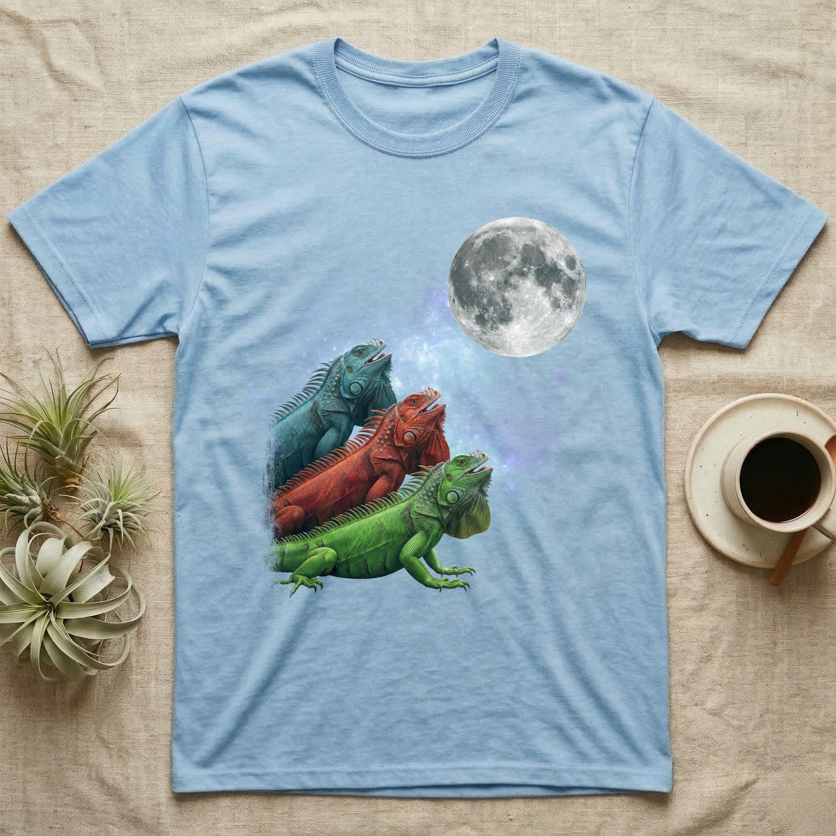 Green Iguana Moon Howl T-Shirt in Light Blue — Three Green Iguana colour morphs howling at a full moon over a nebula on a dark grey t-shirt.