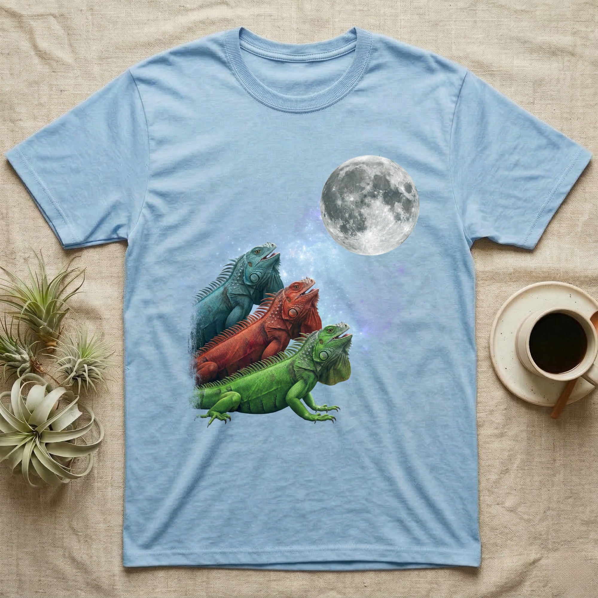 Green Iguana Moon Howl T-Shirt in Light Blue — Three Green Iguana colour morphs howling at a full moon over a nebula on a dark grey t-shirt.