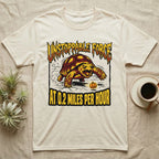 Red-Footed Tortoise Unstoppable Force T-Shirt in Natural — Metal-style furious tortoise charging a candy pumpkin, "Unstoppable Force At 0.2 Miles Per Hour."