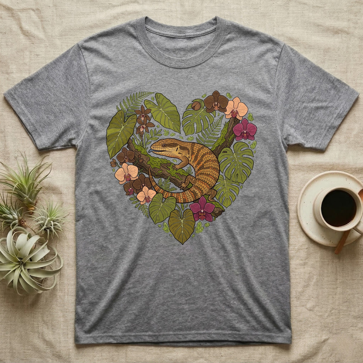 Grey t-shirt with a lizard and floral heart design.