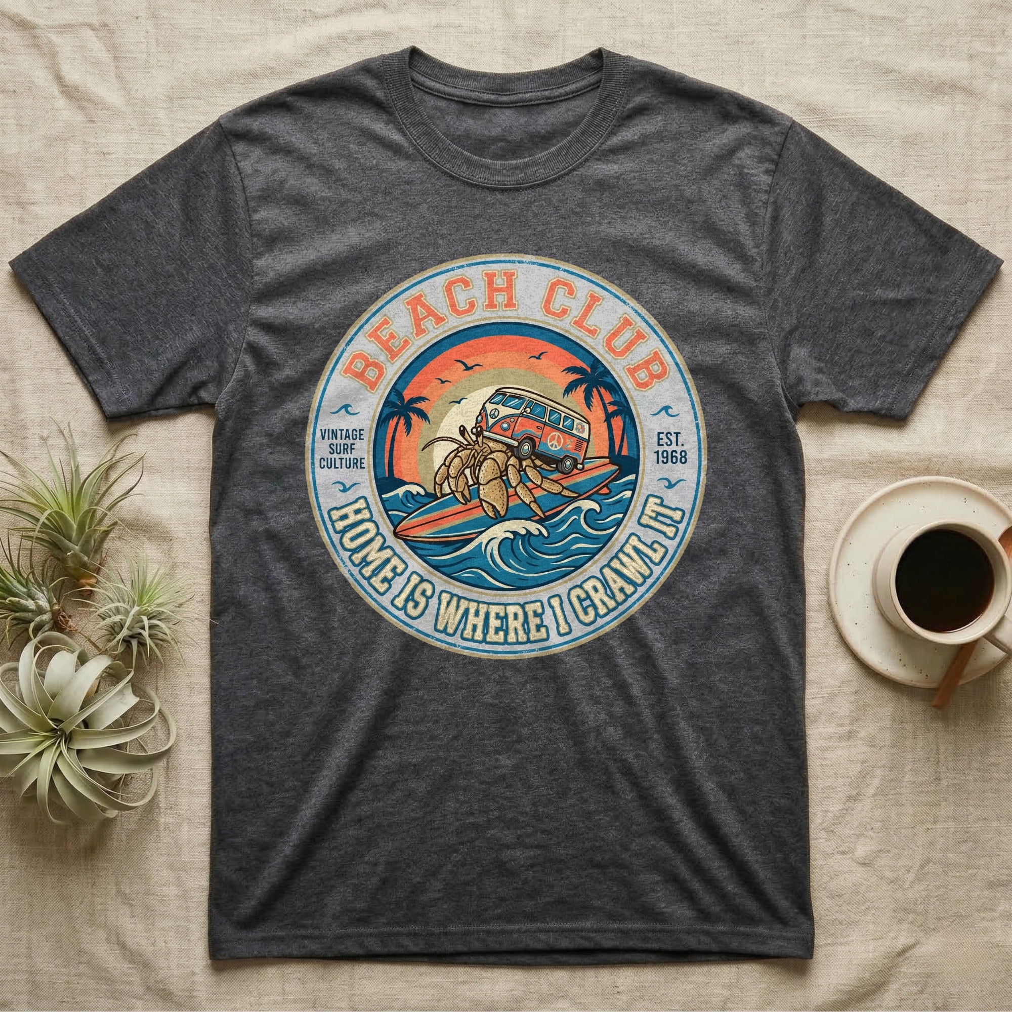 Dark grey t-shirt featuring a circular graphic of a VW bus and crab, "Beach Club" text.