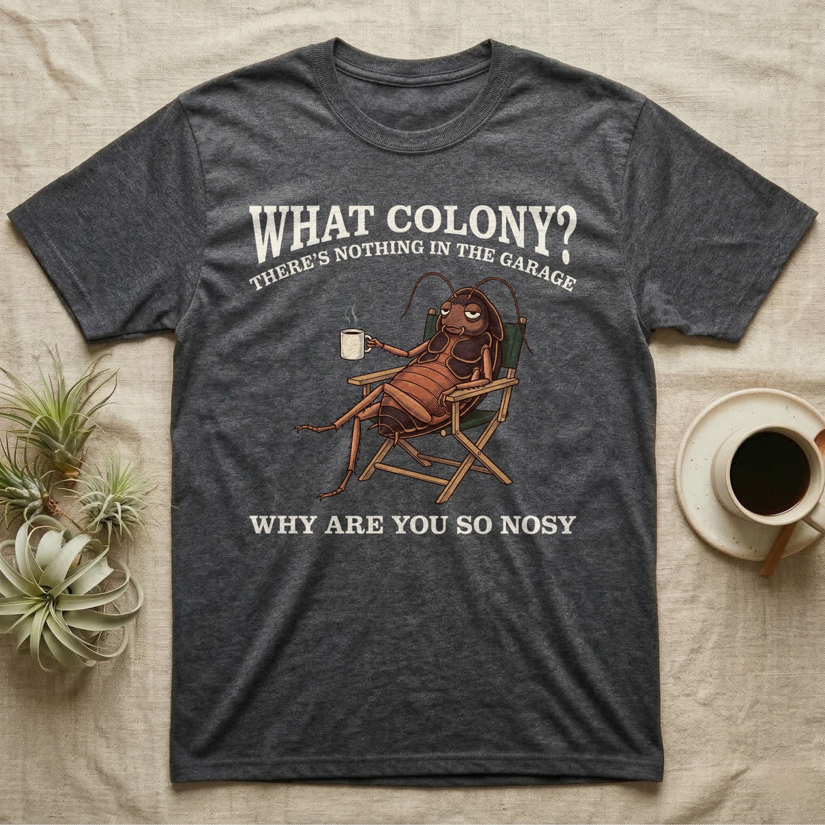 Reptile Roach Colony T-Shirt in Dark Heather — Vintage engraving of a dubia roach lounging in a camp chair with coffee under arched text What Colony on charcoal grey