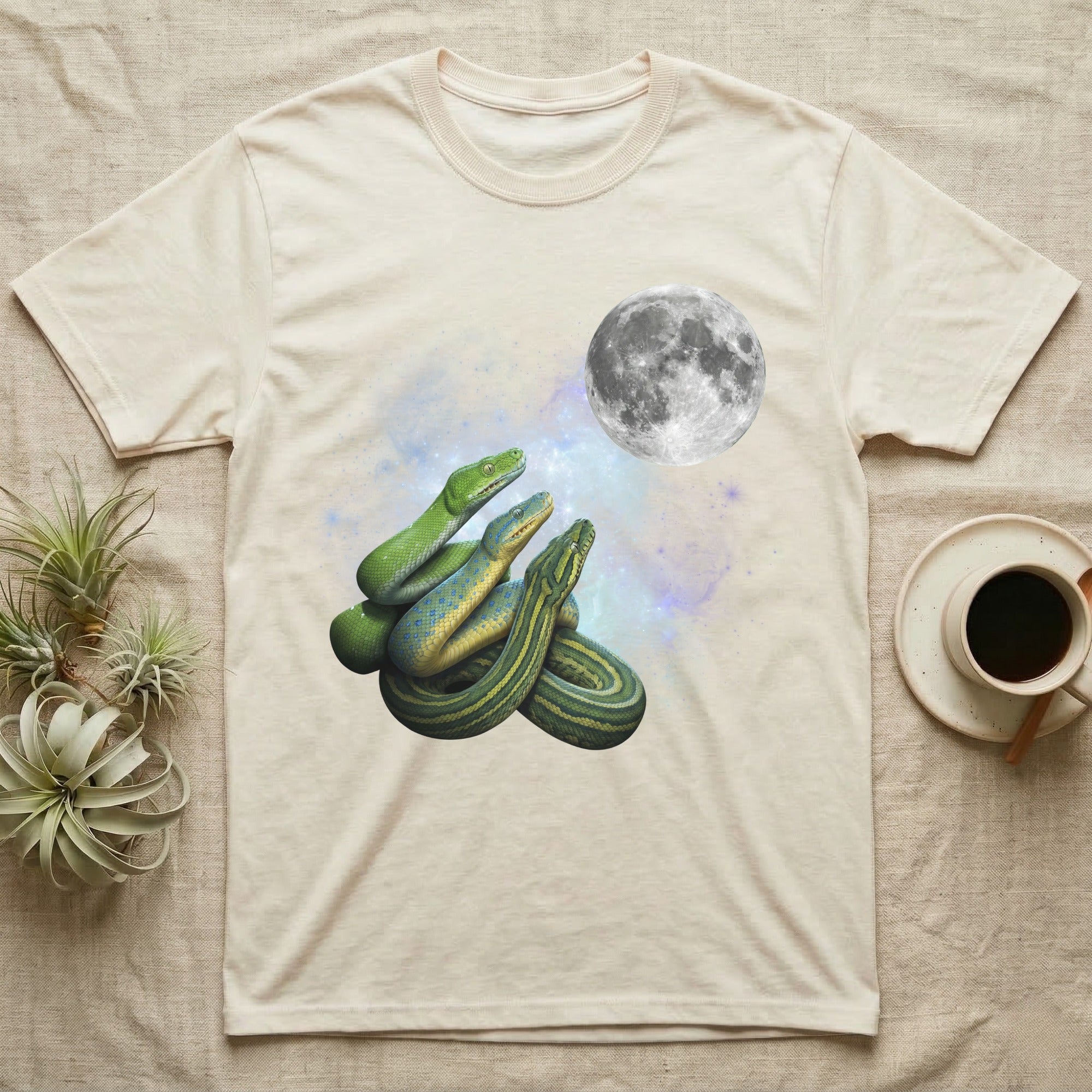 Green Tree Python Moon Howl T-Shirt in Natural — Three Green Tree Python colour morphs howling at a full moon over a nebula on a dark grey t-shirt.