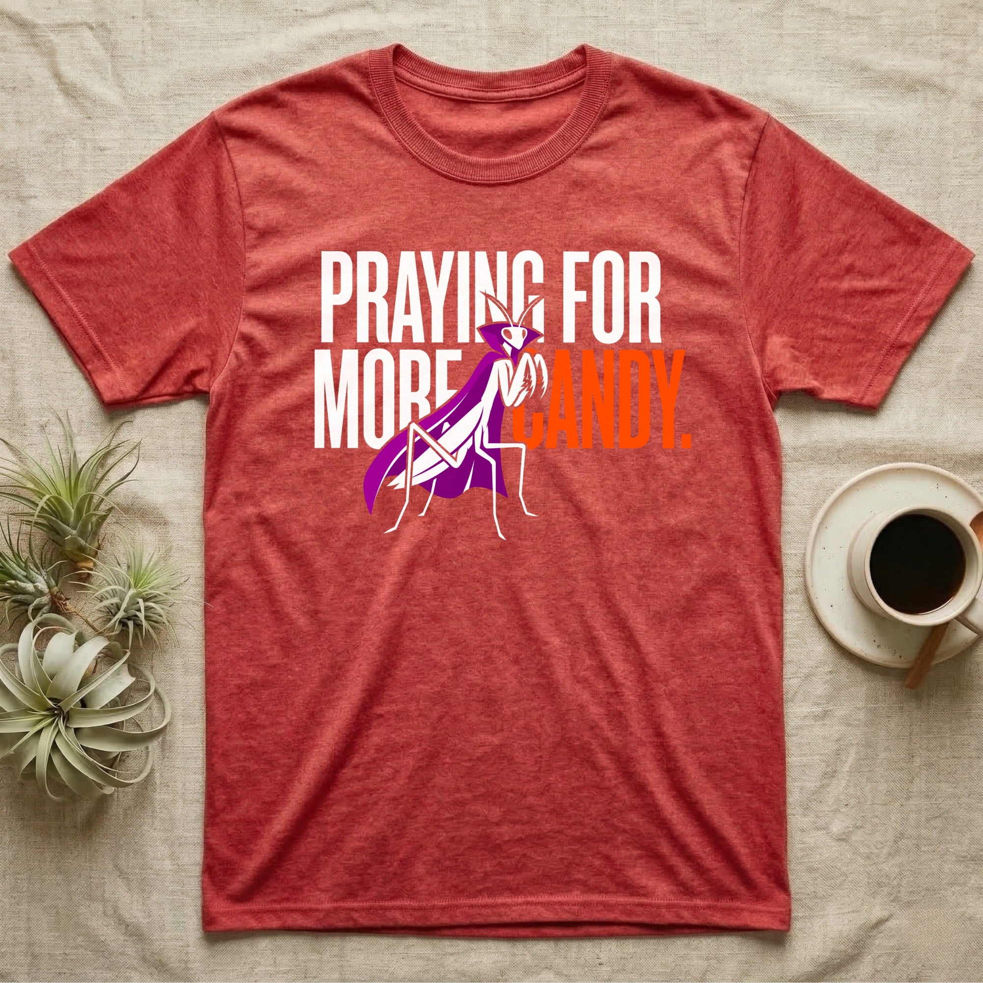 Ghost Mantis Praying For Candy T-Shirt in Heather Red — Minimalist caped ghost mantis rearing up through bold text, "Praying for More Candy."