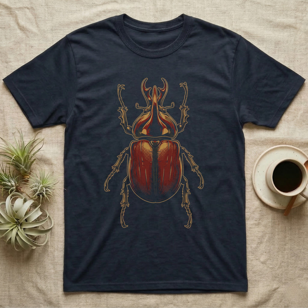 Dorsal-view illustration of a rhinoceros beetle with a forked amber horn and rust-red elytra in bold vintage comic ink line and halftone shading, no on-shirt text. — shown on a Navy tee.