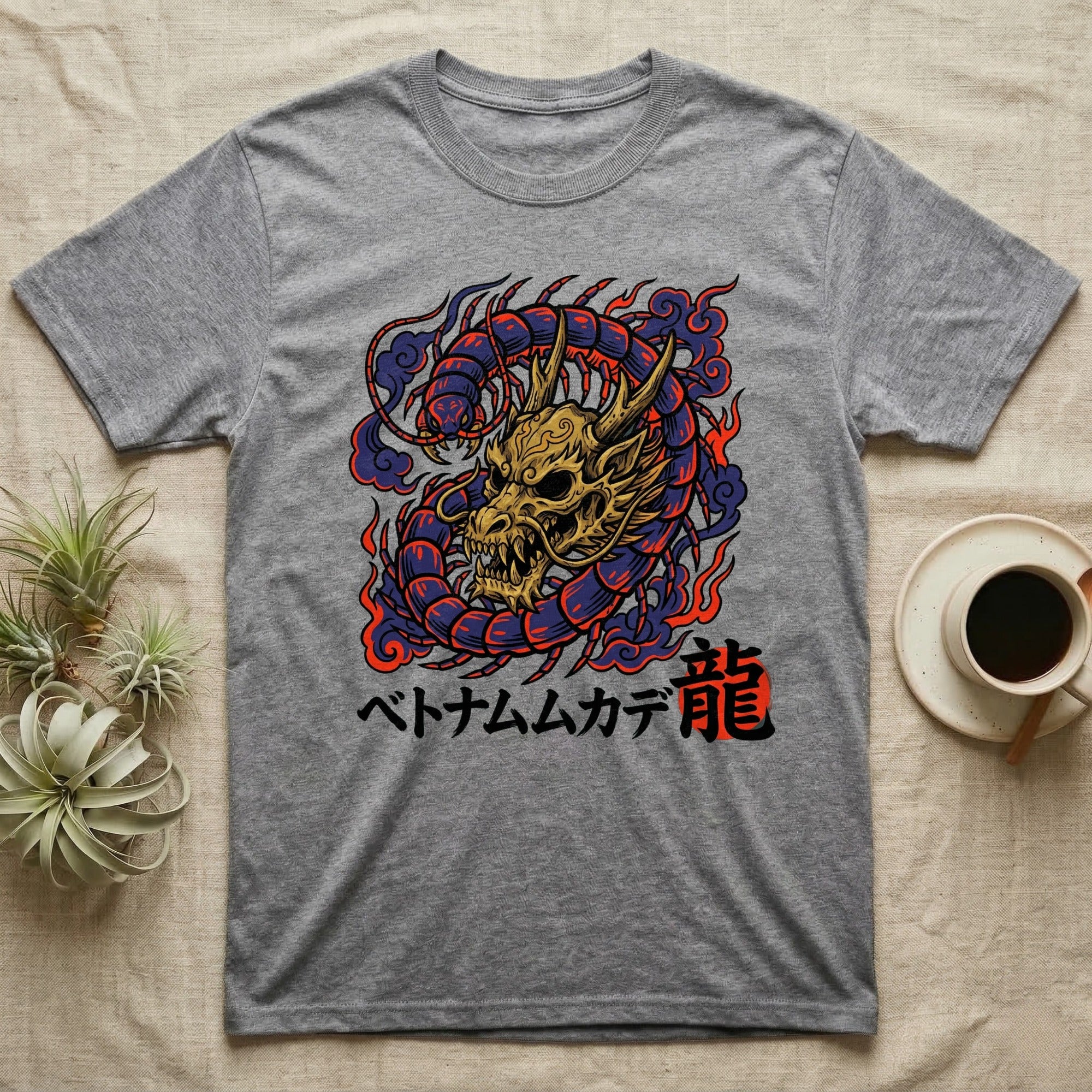 Grey t-shirt with a golden dragon design and Japanese text.