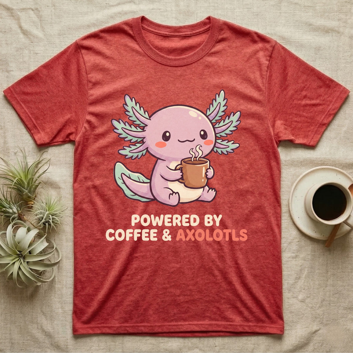 Coffee And Axolotls T-Shirt in Heather Red — Kawaii chibi illustration of an axolotl holding a coffee cup with soft text reading Powered By Coffee And Axolotls.
