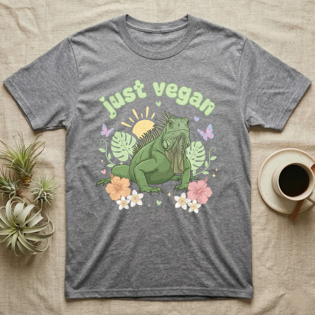 Green Iguana Baby T-Shirt in Sport Grey — Green iguana with spiky crest and dewlap among pastel leaves and flowers under puffy green bubble text "just vegan".