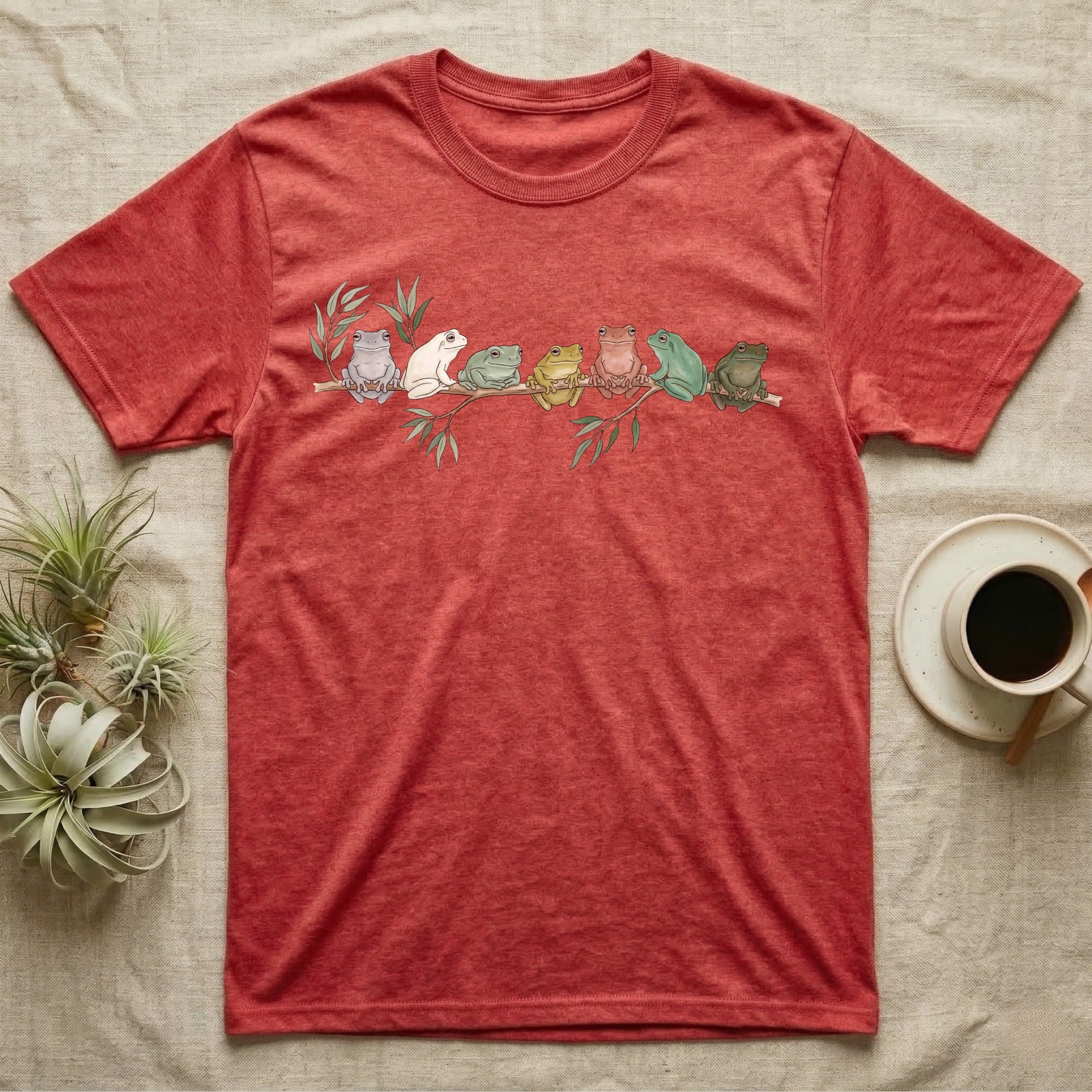 White's Tree Frog Canopy Crew T-Shirt in Heather Red — Watercolor illustration of seven White's tree frogs in different colour phases on a eucalyptus branch, dark grey T-shirt design.
